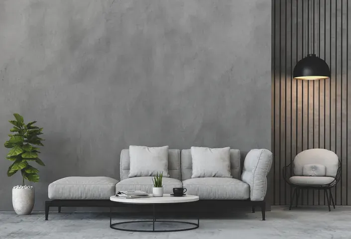 Salón con suelo continuo en tono gris claro y sofá